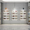 Estantes de exhibición hermosos de la zapatería/jerárquico montado en la pared del estante del zapato del tacón alto proveedor