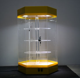 China Base de acrílico rotativa hermosa del amarillo del estante de los soportes de exhibición bloqueable con la luz llevada proveedor