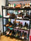 Estructura estable modular negra de los estantes de exhibición de la zapatería para las tiendas especializadas del zapato proveedor